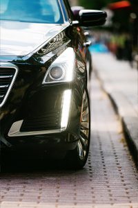 commercial photo of a mercedes with its headlights on